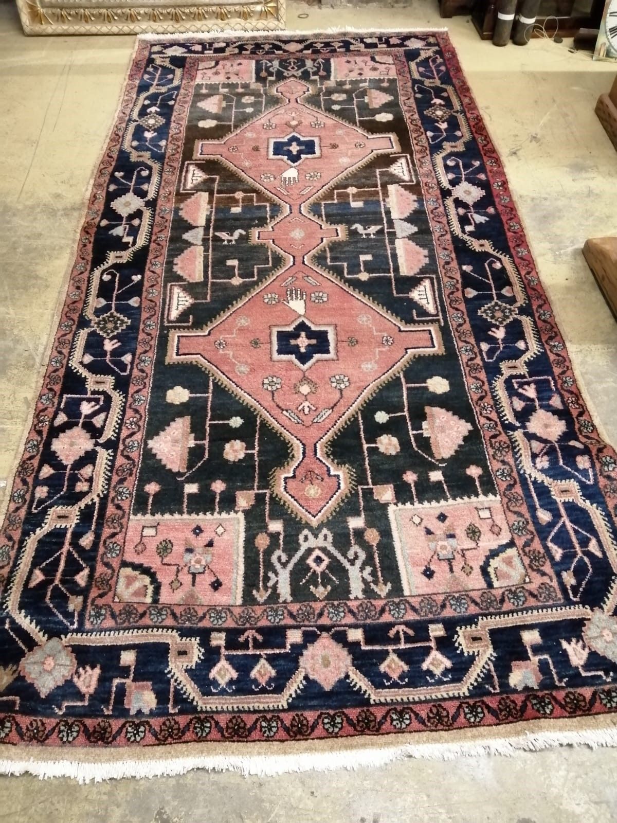 A Caucasian design peach ground rug, 290 x 145cm